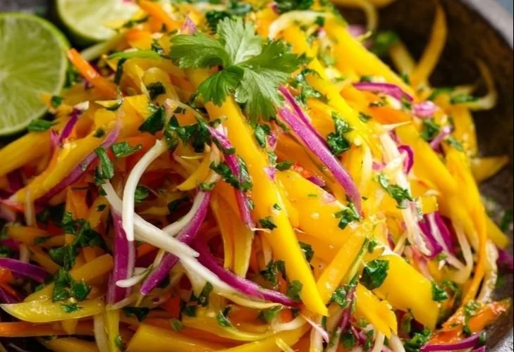 Colorful Mango Slaw with fresh ingredients in a bowl