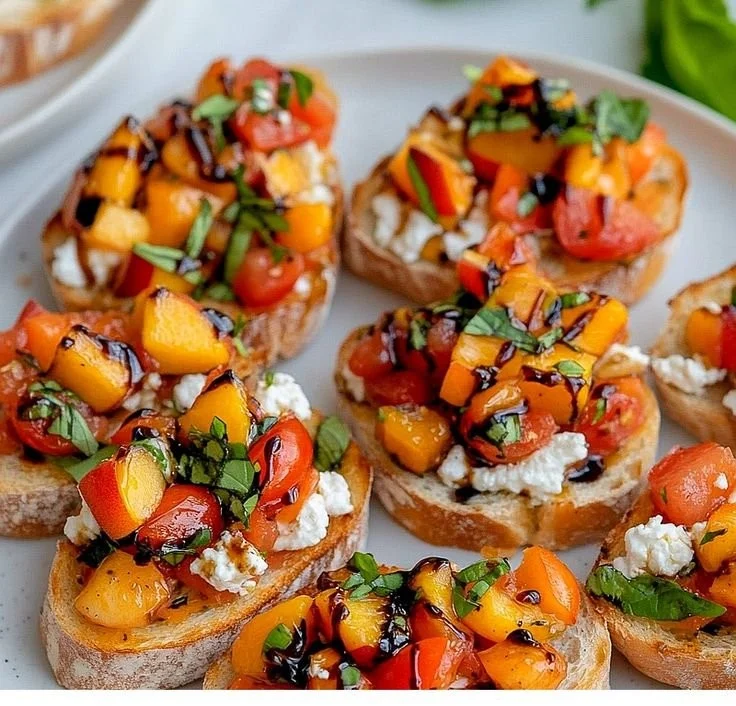 Simple peach bruschetta topped with whipped ricotta on toasted bread